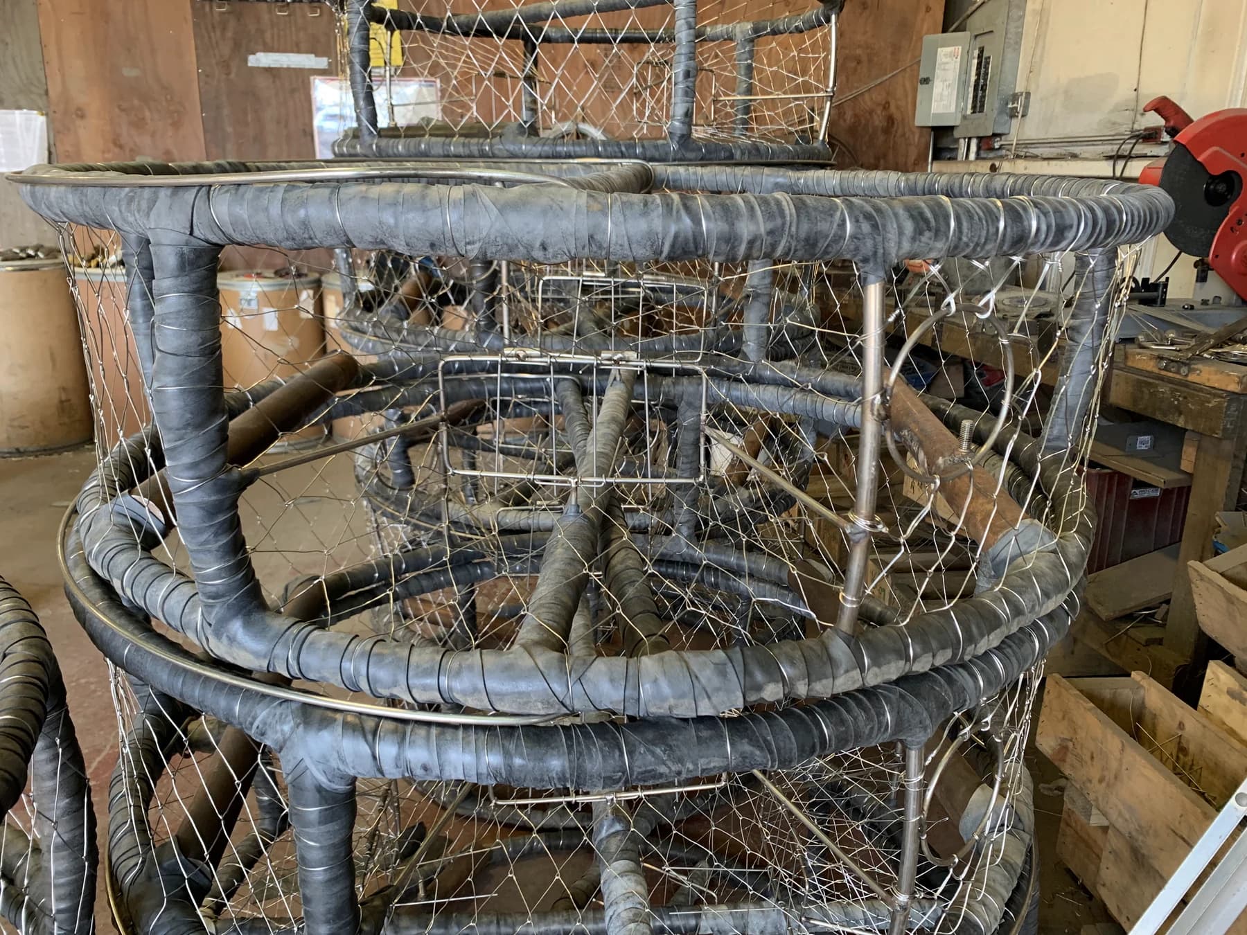 Close view of wrapped frame rings and upright joints on a completed CCP pot in the shop