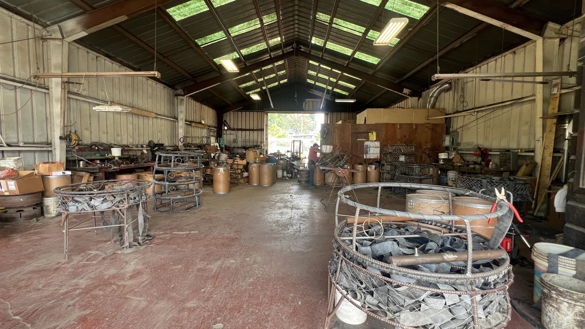 Interior of the Rio Dell CCP shop with frames, tools and a pot being worked on