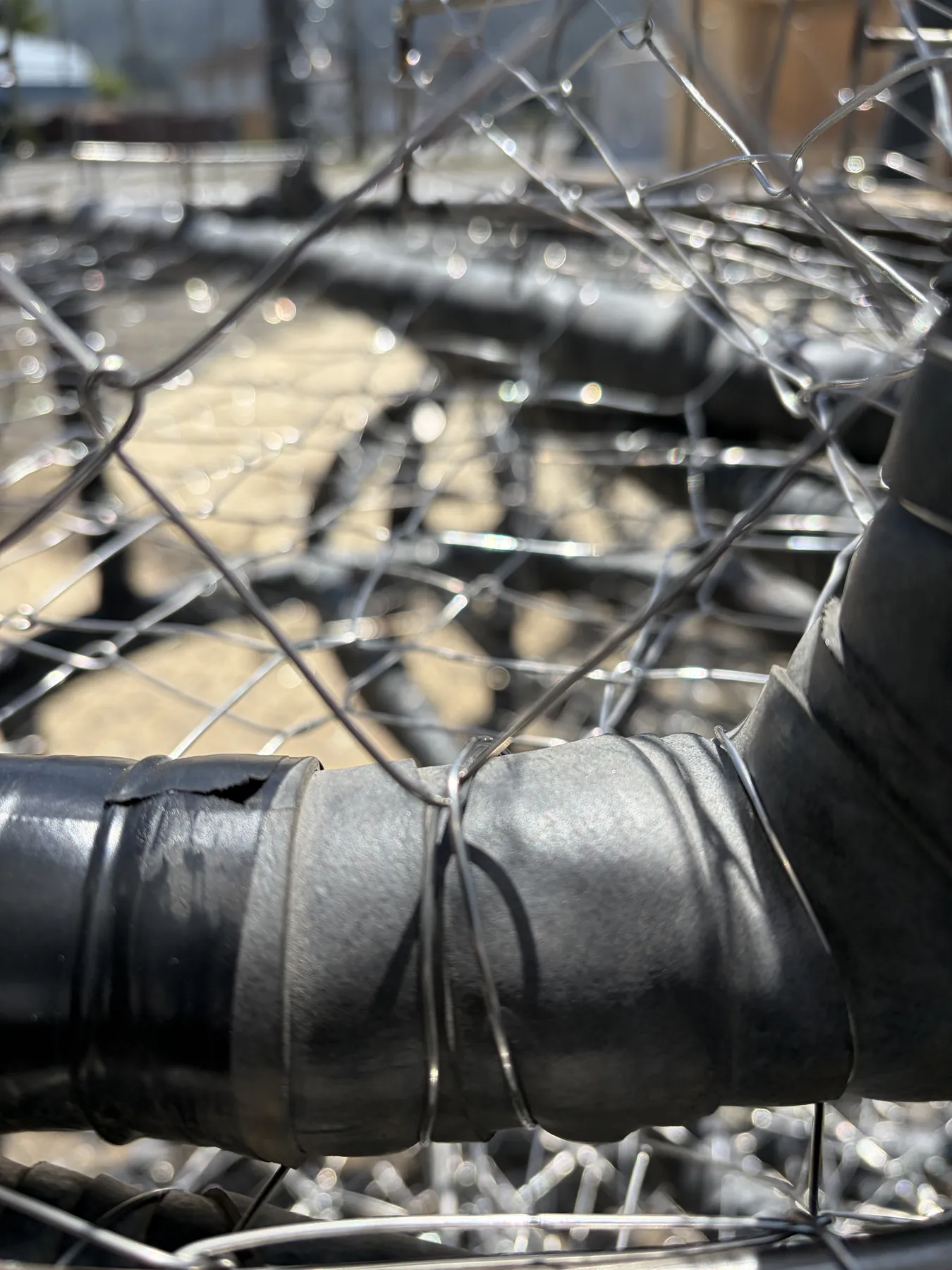 Close view of black rubber wrap on a crab pot frame bar